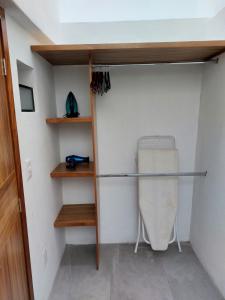 a walk in closet with a mattress and shelves at Casa Monarcas - Sophia (with AC) in Guadalajara +6 photos