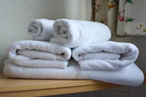 a stack of towels sitting on top of a table at The Beaucliffe Hotel in Blackpool +146 photos