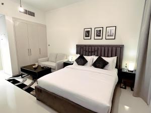 Postel nebo postele na pokoji v ubytování Cozy Studio in Dubai