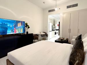 Postel nebo postele na pokoji v ubytování Cozy Studio in Dubai