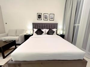 Postel nebo postele na pokoji v ubytování Cozy Studio in Dubai