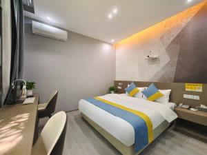 Postel nebo postele na pokoji v ubytování Xian Feng Hotel - Tianfu International Airport Branch