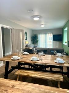 a large wooden table with glasses and plates on it at Castle Rise in Hull