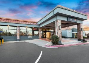 an empty parking lot in front of a building at Suburban Studios Salt Lake City Airport in Salt Lake City