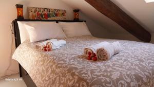 Postel nebo postele na pokoji v ubytování La Corte della Rocca