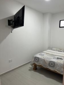 Llit o llits en una habitació de EDIFICIO BUENOS AIRES Apartamento 2 habitaciones