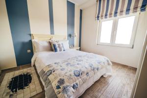 a bedroom with a bed and a window at To Spiti tis Sofias in Kastoria +56 photos