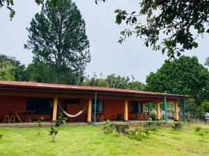a house in the middle of a field at Casa Mano de Tigre in Potrerillos