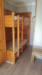 a couple of bunk beds in a room at Appartamento Dolomiti 138 Villaggio Turistico in Carbonin
