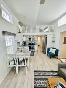 a kitchen and living room with a table and chairs at Vacation Cottage North Myrtle Beach 69 in Myrtle Beach