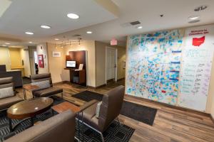 a waiting room with a large map on the wall at TownePlace Suites Columbus Airport Gahanna in Gahanna