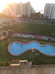 an overhead view of a swimming pool in a city at Altos de San Alfonso in Algarrobo