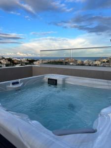 a jacuzzi tub on top of a building at Mayfair by Premier Suites MT in Is-Swieqi