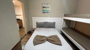 Cama o camas de una habitación en Pousada Central Praias II
