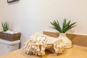 a bathroom with a couch and a plant on a counter at Starry Night Cabin at Sky Ranch in Oakhurst