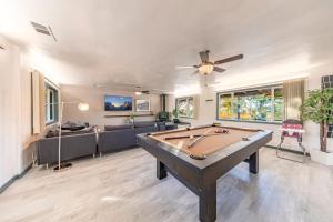 a living room with a pool table in it at Starry Night Cabin at Sky Ranch in Oakhurst