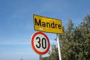 a sign that says manatee and a speed limit sign at Modra Kuca in Mandre