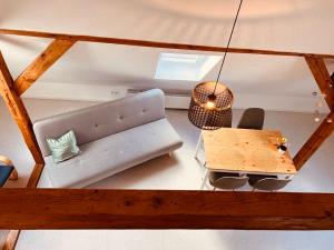 a living room with a couch and a table at Gemütliche Ferienwohnungen Teterow für bis zu 10 Personen in Teterow