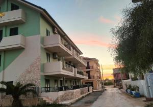 an empty street in front of a building at MareVivo Marzamemi in Marzamemi