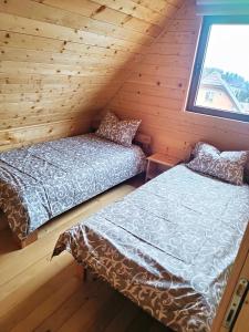 Postel nebo postele na pokoji v ubytování Vila Planinski san 2