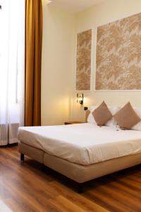 Postel nebo postele na pokoji v ubytování Hotel Giotto Flavia