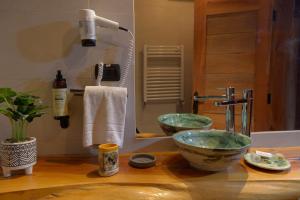 a bathroom sink with a bowl on a counter at Patagonia Lodge in Las Trancas