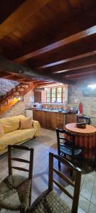 a living room with a couch and a table at Casas Quo Vadis -Azul in Lugo