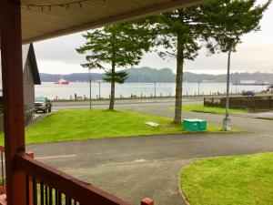 a view of the water from the porch of a house at Telco House B&B in Port Hardy