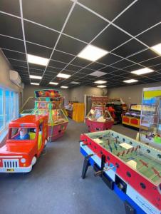 a room filled with lots of different types of games at Golden Sands 6 Berth Beach front Ingoldmells beds made up for arrival WIFI in Ingoldmells