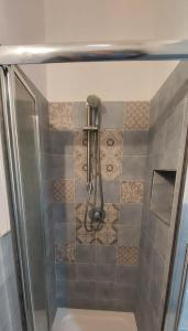 a shower with a shower head in a bathroom at Casa Silvia in Marsala