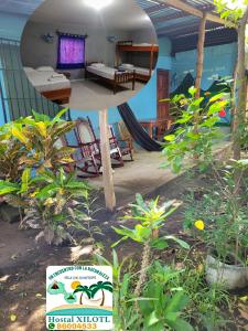 a view of a room with a bed and a sign at Hostal Xilotl in San José del Sur