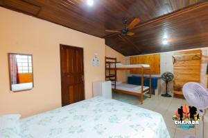 a bedroom with a bed and a bunk bed at Hostel Chapada Dos Guimarães in Chapada dos Guimarães +88 photos