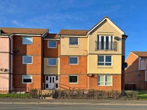 an apartment building on the side of the street at Hindmarsh Apartment in Ashington