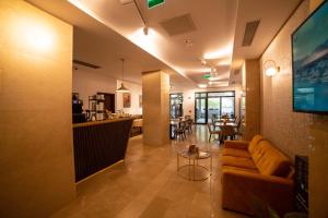 a living room with a couch and a table at Bucharest Airport Accomodation in Otopeni