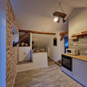 a kitchen with a counter and a stove top oven at Bei Conny und Bernd in Barnstorf