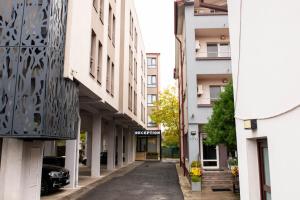 an empty street in a city with buildings at Bucharest Airport Accomodation in Otopeni