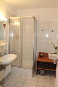 a bathroom with a shower and a sink at Ferienwohnung K1405 für 2-4 Personen mit Ostseeblick in Schönberg in Holstein