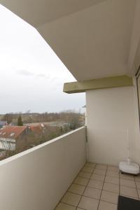a balcony with a toilet on the side of a building at Ferienwohnung L432 für 2-4 Personen an der Ostsee in Brasilien