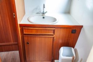 a bathroom with a sink and a toilet at Motoryacht Albatros Proficiat 1120 GL in Buchholz