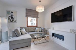 Μια τηλεόραση ή/και κέντρο ψυχαγωγίας στο Exclusive Apartment Motlawa River Oldtown