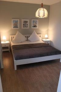 En eller flere senge i et værelse på Jacobihof Haus 7 Wohnung 02