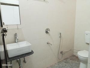 a bathroom with a sink and a shower at 5 PETALS in Varanasi