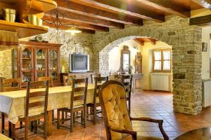 a large dining room with a table and chairs at Villa Altura in Valtura