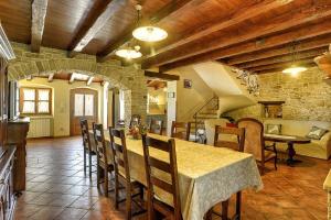 a kitchen and dining room with a table and chairs at Villa Altura in Valtura