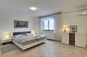 Postel nebo postele na pokoji v ubytování Villa Mima