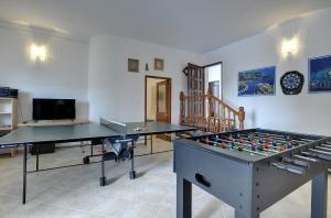 a room with two ping pong tables in it at Villa Mima in Banjole