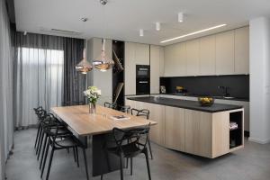 a kitchen and dining room with a table and chairs at Villa PS Deluxe in Pula