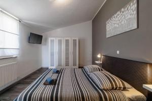 Postel nebo postele na pokoji v ubytování Holiday House Ulika
