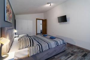 Postel nebo postele na pokoji v ubytování Holiday House Ulika