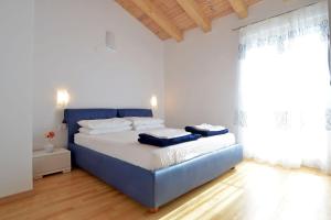 Posteľ alebo postele v izbe v ubytovaní Villa Blue
